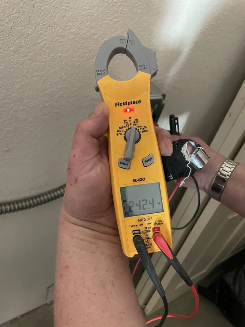Voltage testing with clamp meter during Recessed Lighting Installation in Lakewood Park